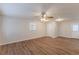 Bright living room with hardwood floors and a ceiling fan at 404 Utoy Sw Cir, Atlanta, GA 30331