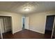 Spacious bedroom with dark hardwood floors and two closets at 6871 Lakeshore Dr, Douglasville, GA 30135