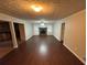 Living room with hardwood floors, a fireplace, and access to the kitchen at 6871 Lakeshore Dr, Douglasville, GA 30135