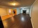 Open concept living room and dining area with hardwood floors and a fireplace at 6871 Lakeshore Dr, Douglasville, GA 30135