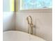 Modern bathroom with a bathtub and a textured tile surround at 153 Palisade Dr, Rydal, GA 30171