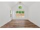 Bright bedroom with vaulted ceiling, hardwood floors, and large windows at 153 Palisade Dr, Rydal, GA 30171