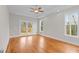 Main bedroom with hardwood floors and access to deck at 153 Palisade Dr, Rydal, GA 30171