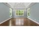 Main bedroom with hardwood floors, tray ceiling and large windows at 153 Palisade Dr, Rydal, GA 30171