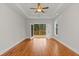 Main bedroom with hardwood floors and access to screened porch at 153 Palisade Dr, Rydal, GA 30171