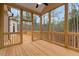 Spacious screened porch with wooden deck and wooded views at 153 Palisade Dr, Rydal, GA 30171