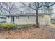 View of the back of the house and yard showing the walk-up entrance to basement at 2534 Ben Hill Rd, Atlanta, GA 30344