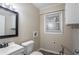 This bathroom features a vanity, toilet, and window at 2534 Ben Hill Rd, Atlanta, GA 30344