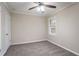 Bedroom featuring neutral walls, gray carpeting, and natural light from the window at 2534 Ben Hill Rd, Atlanta, GA 30344