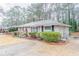 Charming single-story home featuring a brick facade, manicured shrubs, and a well-maintained front yard at 2534 Ben Hill Rd, Atlanta, GA 30344