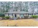 Inviting single-story house with a brick exterior, front lawn, and a cozy entryway steps at 2534 Ben Hill Rd, Atlanta, GA 30344
