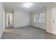 Neutral living room with plush gray carpet, fresh paint, and ample natural light at 2534 Ben Hill Rd, Atlanta, GA 30344