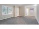 Open living room features neutral tones, a large window, and a cozy, welcoming atmosphere at 2534 Ben Hill Rd, Atlanta, GA 30344
