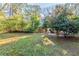 A view of the home's private, expansive, and partially fenced backyard at 3080 Santa Monica Dr, Decatur, GA 30032