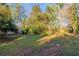 A view of the home's private, expansive, and partially fenced backyard at 3080 Santa Monica Dr, Decatur, GA 30032