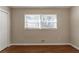 Bedroom features a large double window that provides great light and hardwood floors at 3080 Santa Monica Dr, Decatur, GA 30032