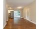 Spacious living room featuring hardwood floors, natural light, and seamless access to the kitchen at 3080 Santa Monica Dr, Decatur, GA 30032