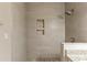Shower features stone-lined niche and floor; shower wall is lined with wide horizontal tiles at 3080 Santa Monica Dr, Decatur, GA 30032