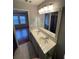 Bathroom with double vanity and updated mirror at 211 Buckland Dr, Alpharetta, GA 30022