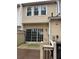 Back exterior view showing sliding glass doors and patio at 211 Buckland Dr, Alpharetta, GA 30022