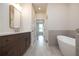 Modern bathroom with double vanity and soaking tub at 620 Goldsmith Ct # 107, Johns Creek, GA 30022