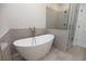 Modern bathroom with soaking tub and shower at 620 Goldsmith Ct # 107, Johns Creek, GA 30022