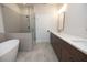 Modern bathroom with double vanity, soaking tub and shower at 620 Goldsmith Ct # 107, Johns Creek, GA 30022