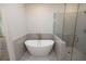 Modern bathroom with soaking tub and shower at 620 Goldsmith Ct # 107, Johns Creek, GA 30022