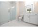 Modern bathroom with white tile, vanity, and glass shower at 620 Goldsmith Ct # 107, Johns Creek, GA 30022