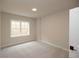 Spacious bedroom with carpet and a large window, offering ample natural light at 620 Goldsmith Ct # 107, Johns Creek, GA 30022