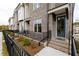 Brick townhome with teal door and black fence at 620 Goldsmith Ct # 107, Johns Creek, GA 30022