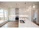 Modern kitchen with white cabinets, stainless steel appliances, and a view of the backyard at 620 Goldsmith Ct # 107, Johns Creek, GA 30022