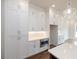 White kitchen cabinets and a built-in microwave at 620 Goldsmith Ct # 107, Johns Creek, GA 30022