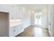 Bright office features built-in white cabinets and hardwood floors at 620 Goldsmith Ct # 107, Johns Creek, GA 30022