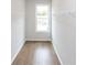 Spacious walk-in closet with wire shelving and wood flooring at 620 Goldsmith Ct # 107, Johns Creek, GA 30022