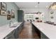 Modern clubhouse kitchen with large island and stainless steel appliances at 5330 Memento Trace, Cumming, GA 30040