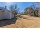 Open backyard with sloped lawn at 5725 Twain Dr, Ellenwood, GA 30294