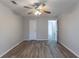 Bright bedroom with ceiling fan and wood-look flooring at 5725 Twain Dr, Ellenwood, GA 30294