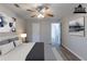 Spacious bedroom with ceiling fan and virtually staged furniture at 5725 Twain Dr, Ellenwood, GA 30294