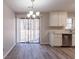Dining area with hardwood floors and sliding glass doors at 5725 Twain Dr, Ellenwood, GA 30294