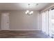 Bright dining room with chandelier and sliding glass doors at 5725 Twain Dr, Ellenwood, GA 30294