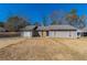 Ranch style home with gray siding, stone accents, and attached garage at 5725 Twain Dr, Ellenwood, GA 30294
