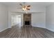 Living room with vaulted ceiling, fireplace, and hardwood floors at 5725 Twain Dr, Ellenwood, GA 30294