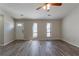 Living room with hardwood floors and large windows at 5725 Twain Dr, Ellenwood, GA 30294