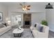 Spacious living room with stone fireplace and hardwood floors at 5725 Twain Dr, Ellenwood, GA 30294