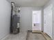 Unfinished room with water heater at 5725 Twain Dr, Ellenwood, GA 30294