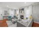 Living room with hardwood floors, fireplace, and stylish furnishings at 840 Ash St, Canton, GA 30114