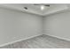 Basement room with ceiling fan and grey tile floor at 1400 Cresthaven Ln, Lawrenceville, GA 30043