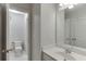 Clean bathroom with vanity, toilet, and mirror at 1400 Cresthaven Ln, Lawrenceville, GA 30043