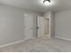 Spacious bedroom with two doors and carpet at 1400 Cresthaven Ln, Lawrenceville, GA 30043